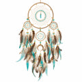 Attrape-rêves bohème artisanal avec plumes turquoise et marron