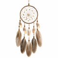 Attrape-rêves mural artisanal avec plumes beige et marron